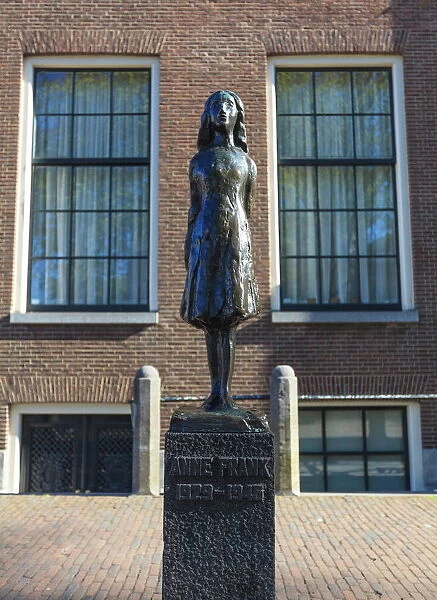 Statue of Anne Frank outside Westerkerk, near her house, Amsterdam, Netherlands, Europe