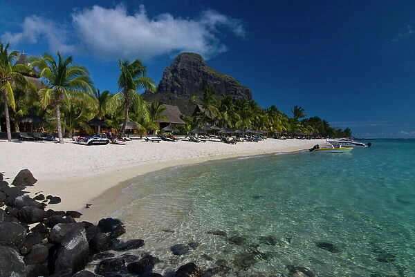 Sun loungers on the beach and Mont Brabant (Le Morne Brabant), UNESCO World Heritage Site