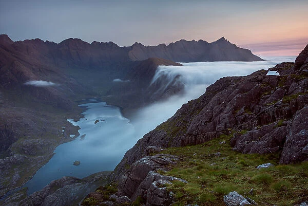 Sunrise at a wild camp on the hills above Loch Coruisk on Skye with a cloud inversion