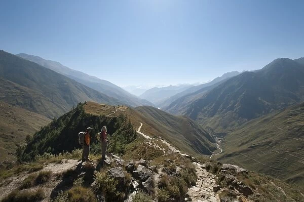 Taking a pause from the trail at a viewpoint in the Juphal Valley, Nepal, Himalayas, Asia