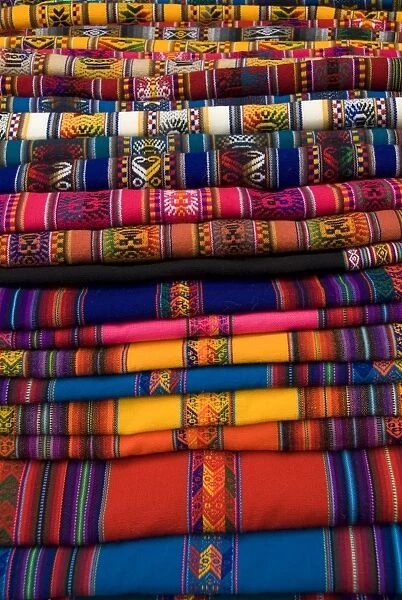 Textiles for sale in the market in the village of Pisac, The Sacred Valley