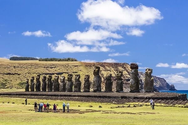 Tourists at the 15 moai restored ceremonial site of Ahu Tongariki on Easter Island (Isla de Pascua) (Rapa Nui), UNESCO World Heritage Site, Chile, South America