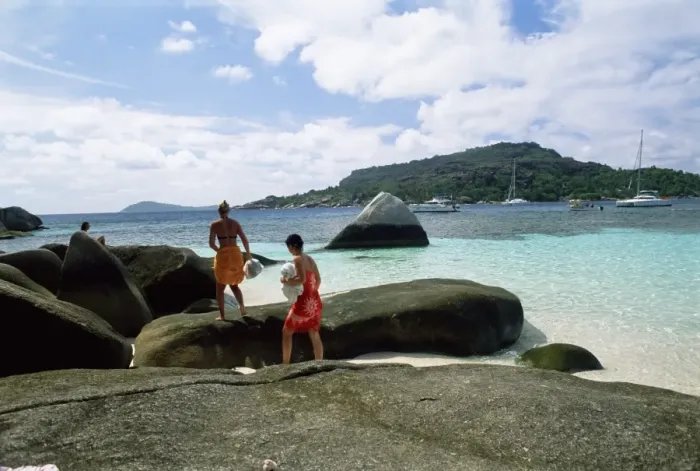 Framed Print : Tourists on rocks Print, Seychelles Framed Print : Tourists on rocks Print, Seychelles