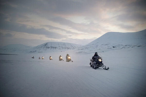 Tourists on snowmobiles (skidoos) near Barentsburg, Svalbard, Arctic, Norway, Scandinavia, Europe