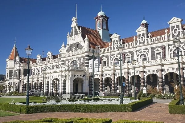 View from gardens to the imposing facade of Dunedin Railway Station, Anzac Square