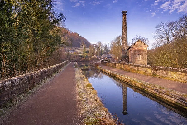 View of mackerel sky and old pump station beside the Cromford Canal, Derbyshire, England, United Kingdom, Europe