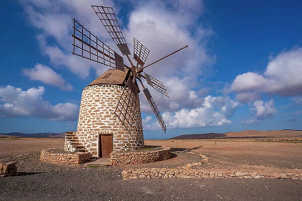 View of traditional windmill and landscape on a sunny day, La Oliva, Fuerteventura, Canary Islands, Spain, Atlantic, Europe