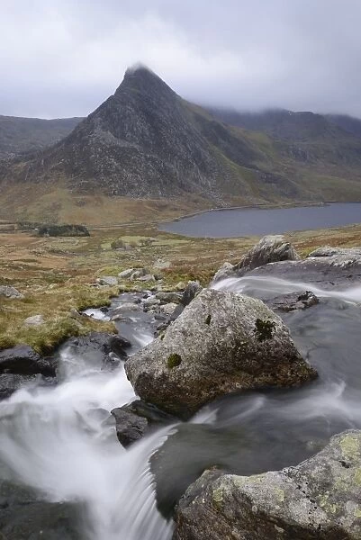 Water cascading down a fall on the Afon Lloer, overlooking the Ogwen Valley and Tryfan
