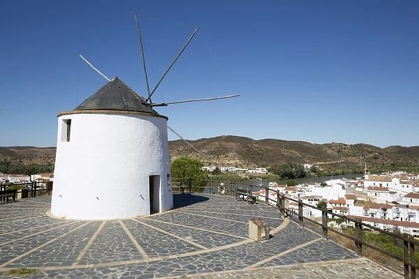 Windmill above village and Rio Guadiana river with view to Portugal, Sanlucar de Guadiana