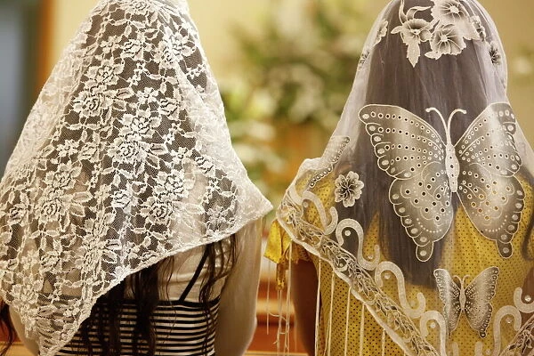 Women wearing embroidered veils at Holy Mass, Beit Jala, West Bank, Palestine National Authority