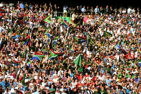 Fans wave the South African flag in the stands at Ellis Park during the 1995 Rugby World Cup Final