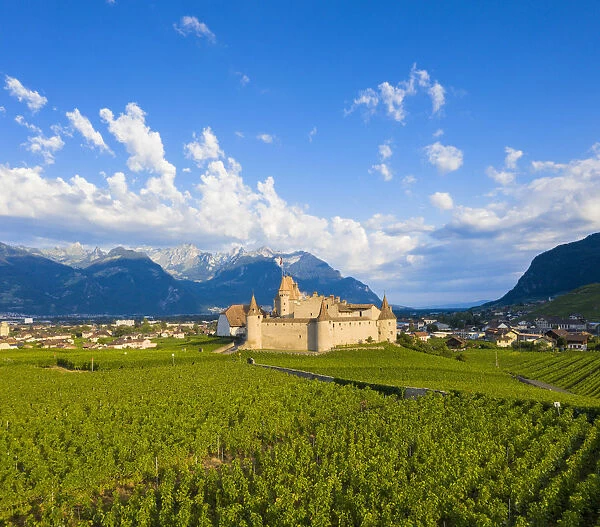 Aerial panoramic of Aigle Castle and village, canton of Vaud, Switzerland