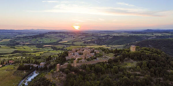 Aerial sunset over medieval town, Monticchiello, Val d Orcia, Tuscany, Italy