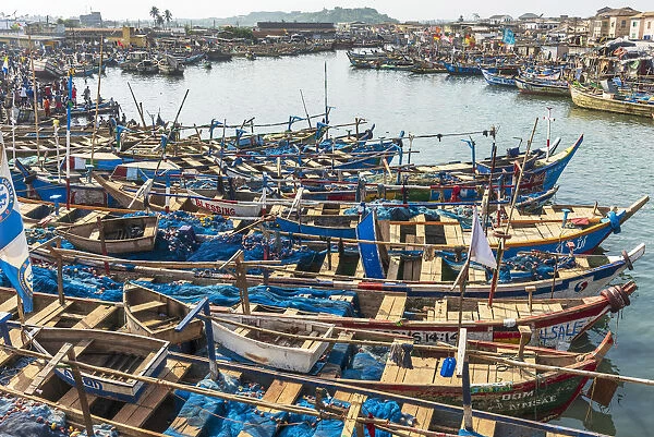 Africa, Ghana, Elmina harbour. Traditional wooden fishing boats in the harbour