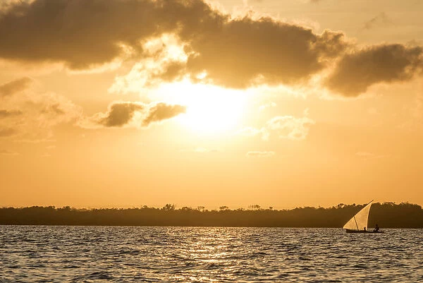 Africa, Tanzania, Lindi region. Songo Mnara Island. Fishermen returning home at sunset