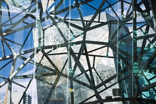 Australia, Victoria, Melbourne. View through the glass and metal architecture of Federation Square