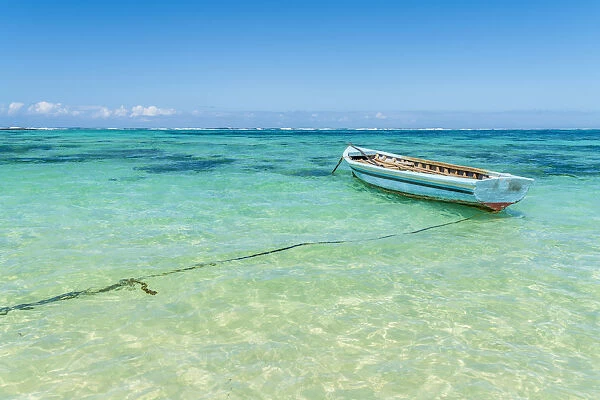 Empty boat moored in the turquoise sea, Poste Lafayette, Indian Ocean, East coast
