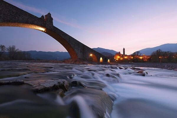 The bridge Gobbo of Bobbio at dusk, Piacenza district, Italy
