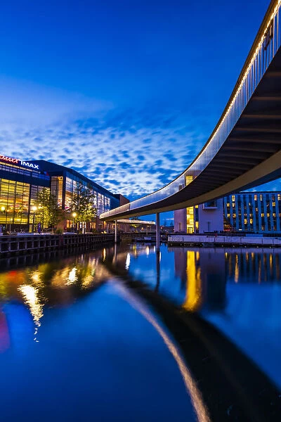 Bridge reflecting in the water canal and Fisketorvet shopping centre in the background by