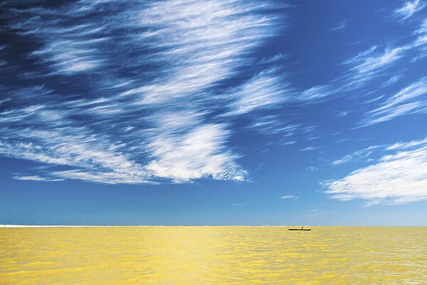 Cloudscape over Lone Boat, Madgascar