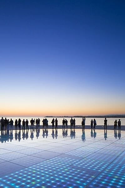 Croatia, Zadar Region, Zadar. Sunset at the Greeting to the Sun - a 22 metre installation