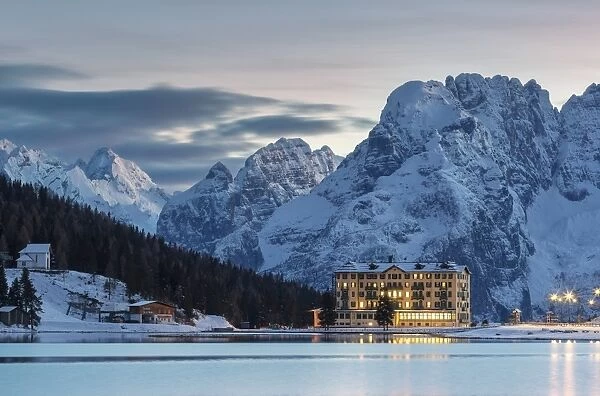 Dusk in Misurina, Auronzo, Dolomites, Veneto, Italy. Winter landscape with frozen lake