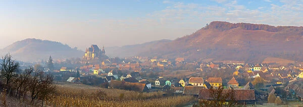 Elevated view over Biertan at sunrise, Biertan, nr. Sighisoara, Transylvania, Romania