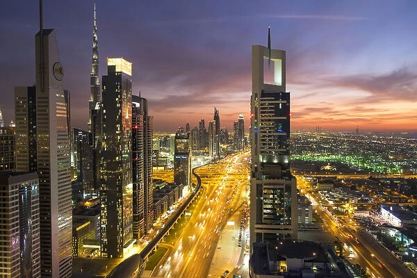 Elevated view at dusk over Downtown & Sheikh Zayed Road looking towards the Burj
