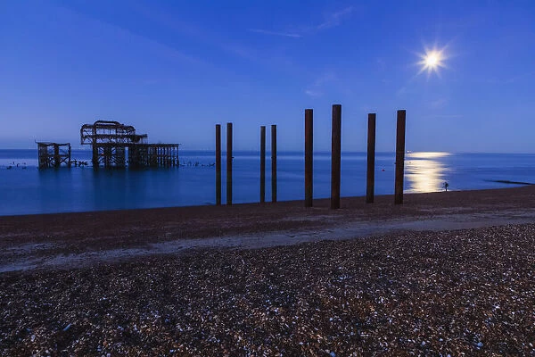 England, East Sussex, Brighton, , Brighton Beach, The Ruins of West Pier at Night