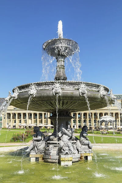 Fountain at Schlossplatz Square with a view on Konigsbau building, Stuttgart, Baden-Wurttemberg, Germany