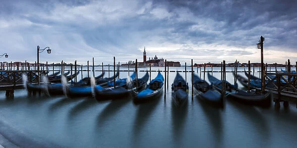 Gondolas moored at sunset, St. Marks basin, Venice, Italy
