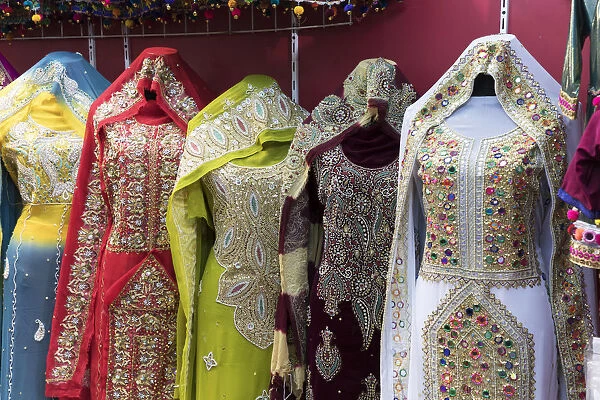 Ornate dresses for sale in Mutrah souk, Muscat, Oman