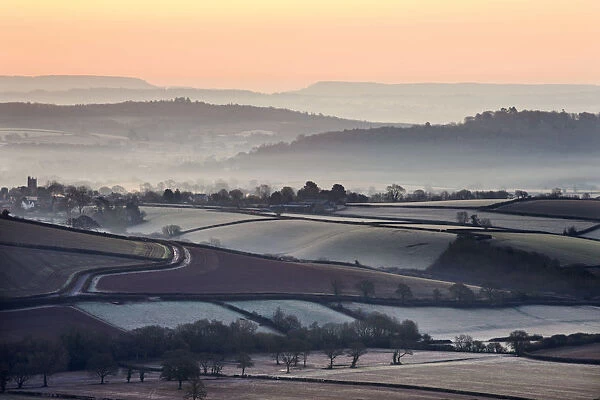 Overlooking frost and mist covered countryside at dawn near the village of Silverton