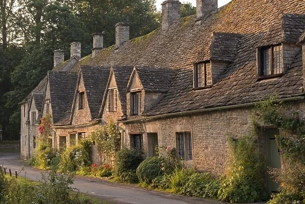 Picturesque cottages at Arlington Row in the Cotswolds village of Bibury, Gloucestershire, England