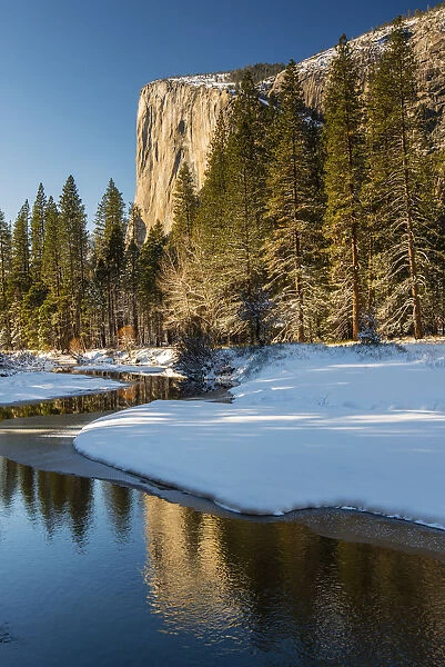 Scenic winter landscape with El Capitan mountain reflected in the river, Yosemite