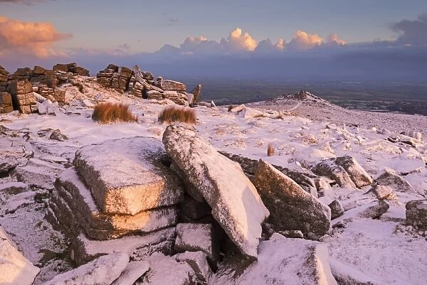 Snow covered Belstone tor at dawn, Dartmoor, Devon, England. Winter (January) 2016
