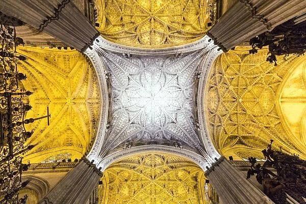 Spain, Andalusia, Seville. Ornate ceiling inside the Cathedral of Saint Mary of the See