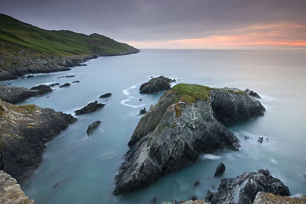 Sunset over Oreweed Cove on the Morte Point peninsula, North Devon, England. Summer