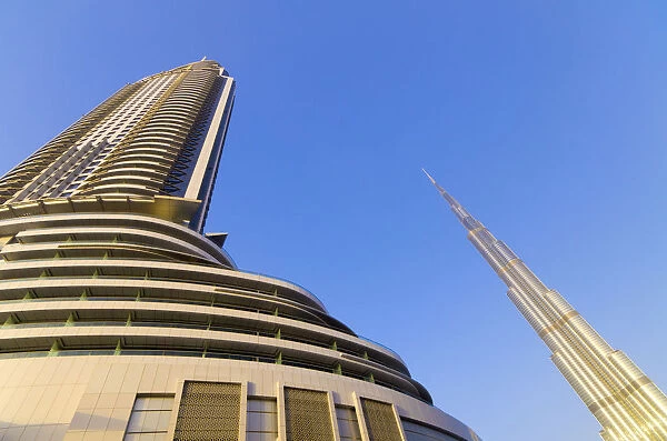 UAE, Dubai, The Address Downtown Hotel, on left, and Burj Khalifa