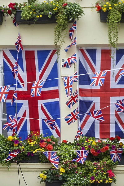 UK, England, London, Kensington, The Churchill Arms Pub with Union Jack bunting to