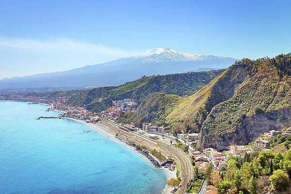 View of the Ionian coast and mount Etna in the distance, Taormina, Sicily, Italy