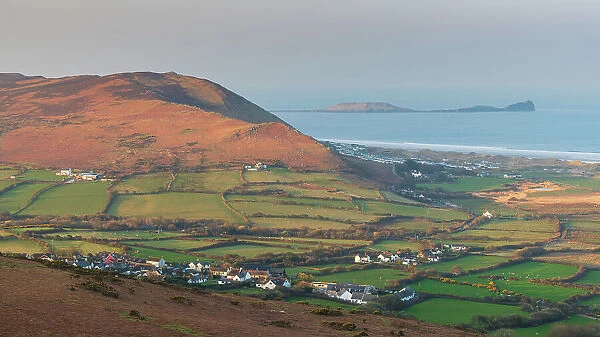 View from Llanmadoc Hill over the village of Llangennith towards Rhossili Bay and Worm's Head, Gower Peninsula, South Wales, UK. Spring (March) 2022
