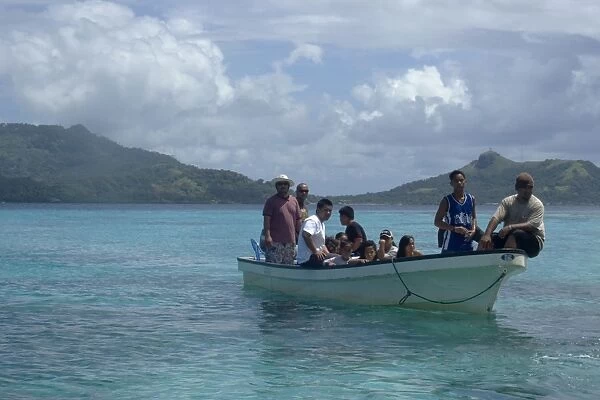 Boat with local family approaches island for a day trip, Truk lagoon, Chuuk, Federated States of Micronesia, Pacific