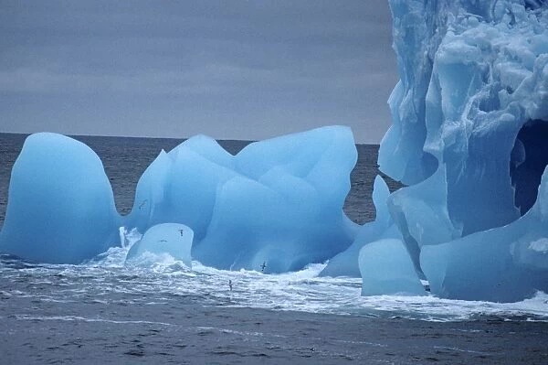Close detail of blue iceberg full of holes and cavities. Near Antarctic Peninsula, Antarctica