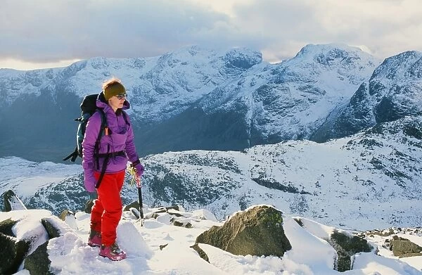 A woman walking on Crinkle Crags in the Lake District UK