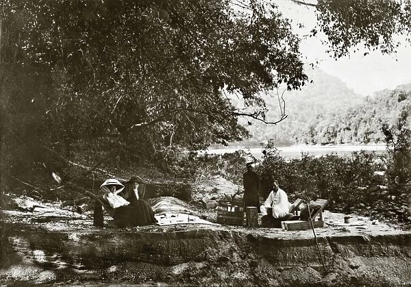 View of group of people having picnic at an unidentified location, possibly in India