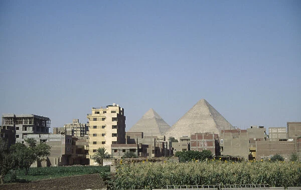 20039838. EGYPT Cairo City suburbs encroaching on the Pyramids at Giza
