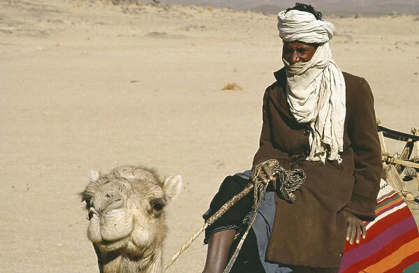 20050286. ALGERIA Tribal People Cropped view of Tuareg man riding camel