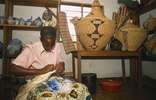 20062745. TANZANIA West Great Lakes Region Refugee making traditional woven baskets