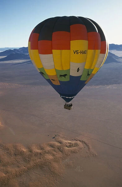 20066177. NAMIBIA Namib Rand Reserve Hot air balloon above Camp Mwisho